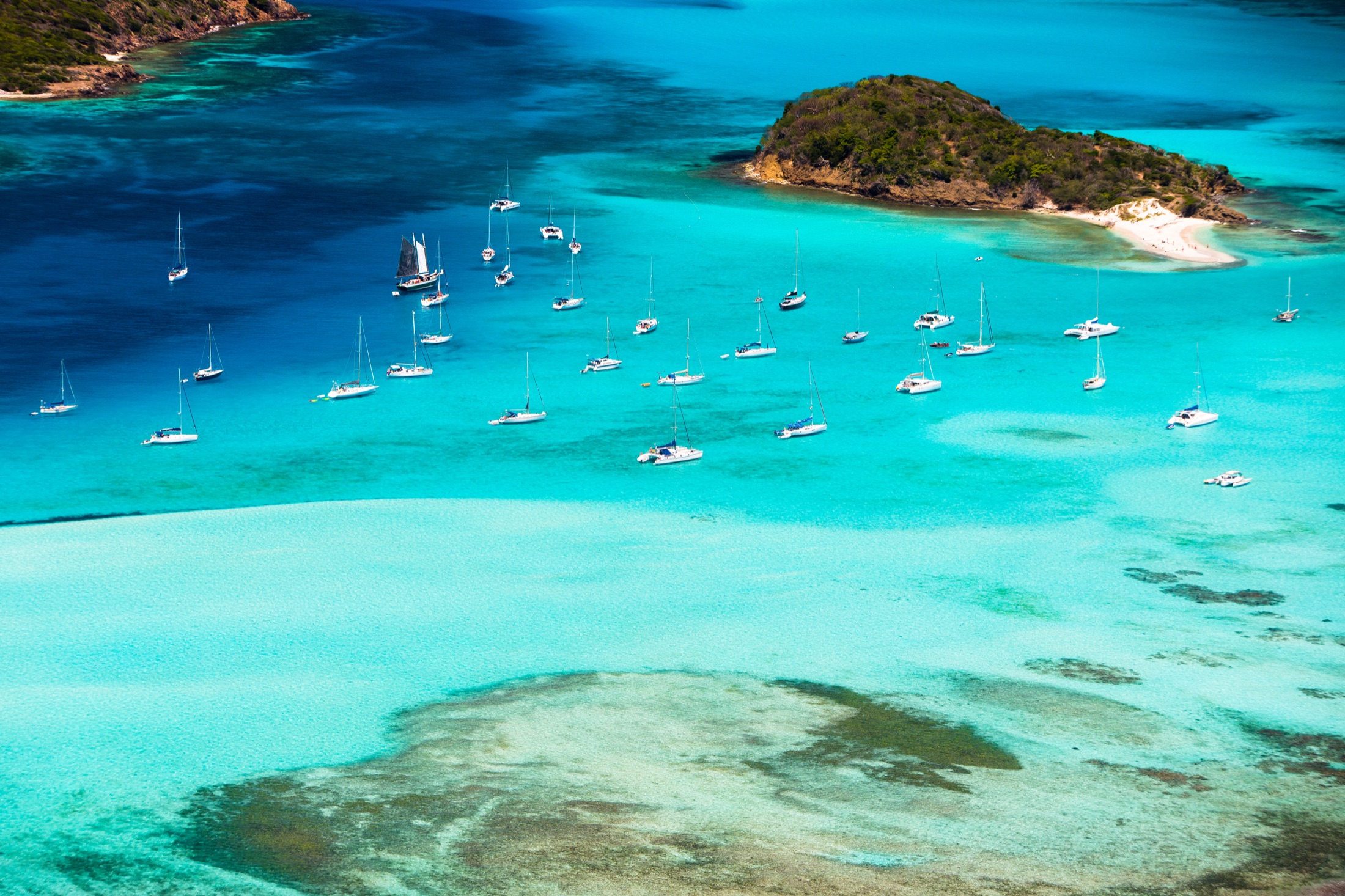 Drone view of a Tobago Cays beach and deep blue water