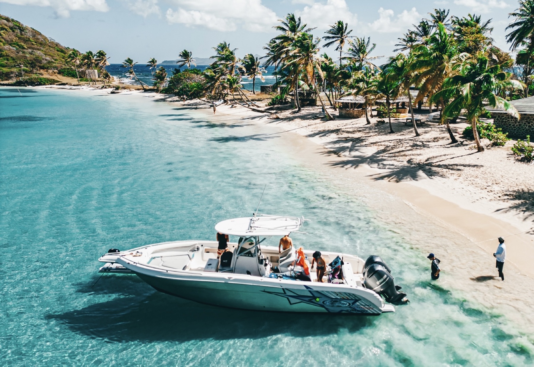 Private boat arriving on a Southern Grenadines beach excursion